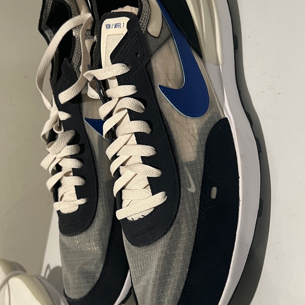 Nike Men's Black and White Sneakers with Blue Accents